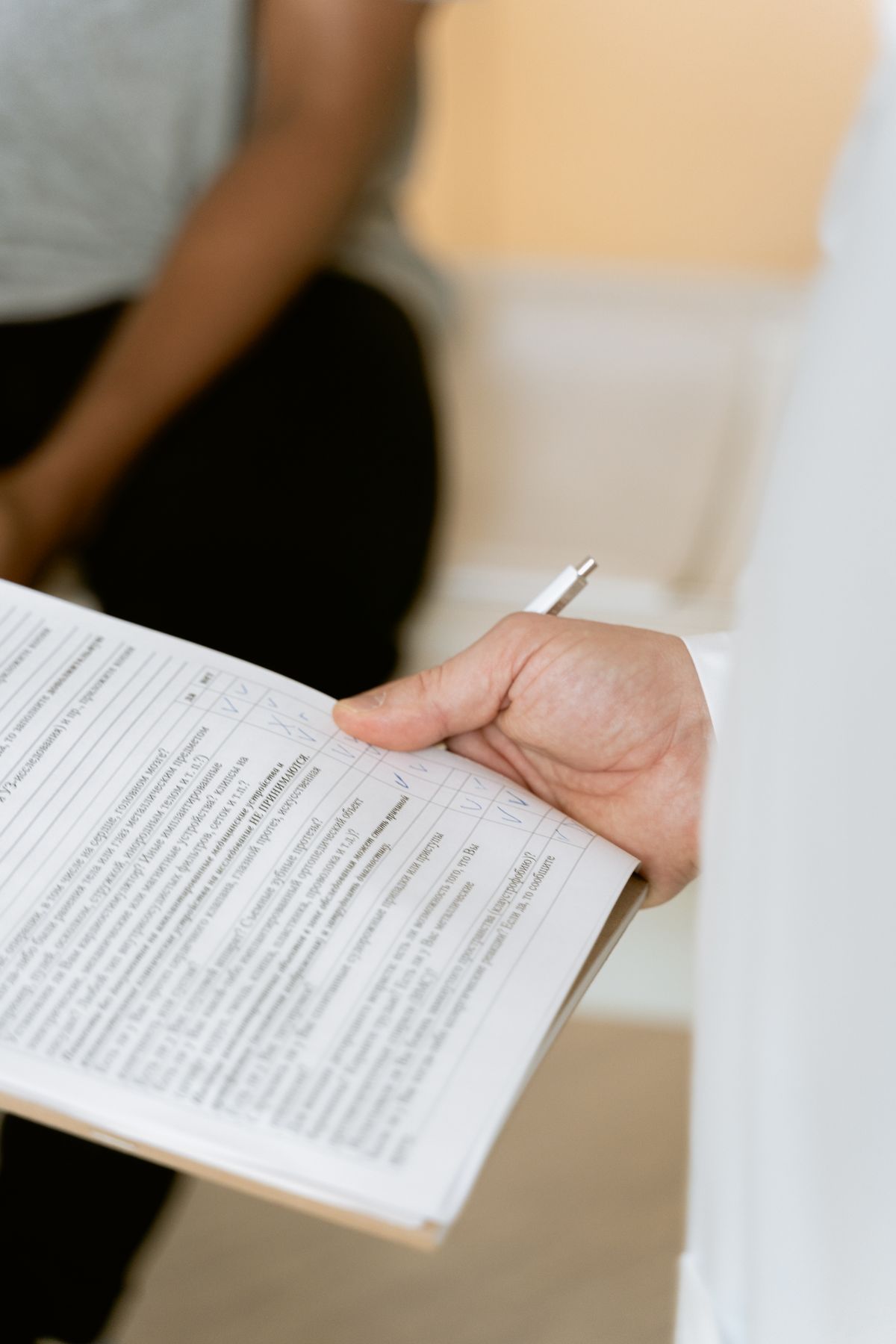 Healthcare professional reviewing a medical chart
