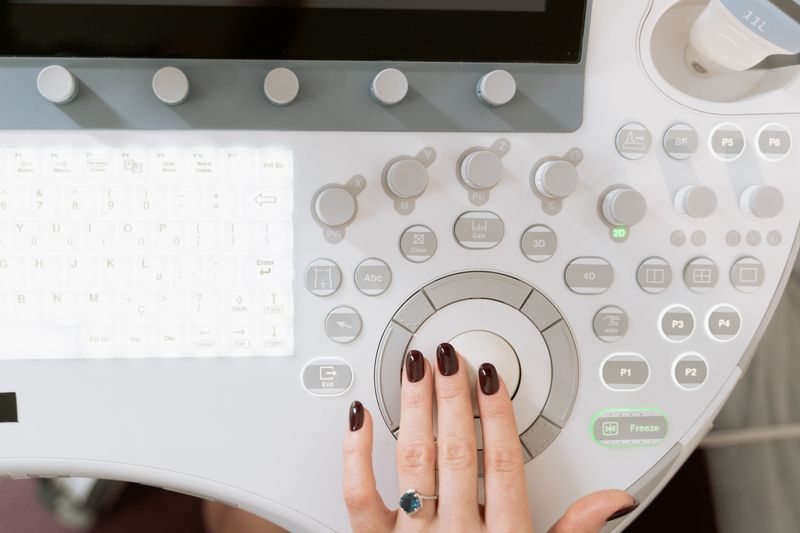Elective ultrasound studio owner reviewing candidate applications for a staff operator position