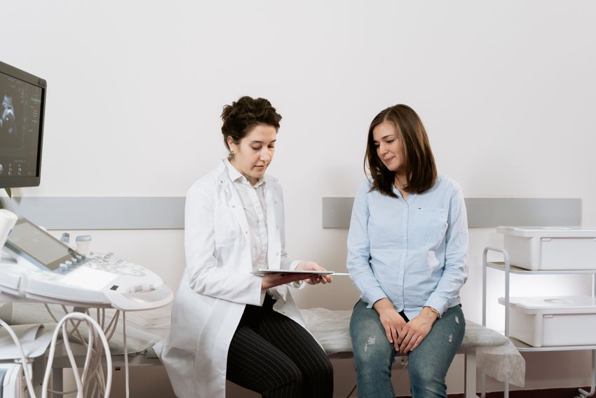 Pregnant woman consulting with a healthcare professional