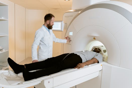 A doctor operates an MRI machine with a patient undergoing a scan in a medical facility.