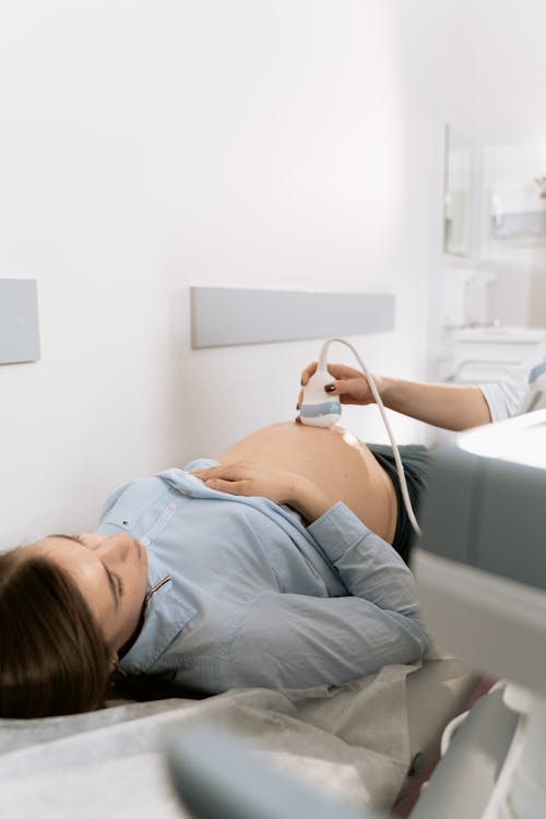 Photo Of Pregnant Woman Doing An Ultrasound Test