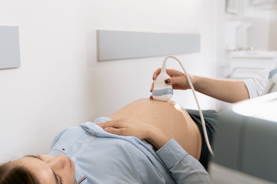 Pregnant woman receiving an ultrasound scan