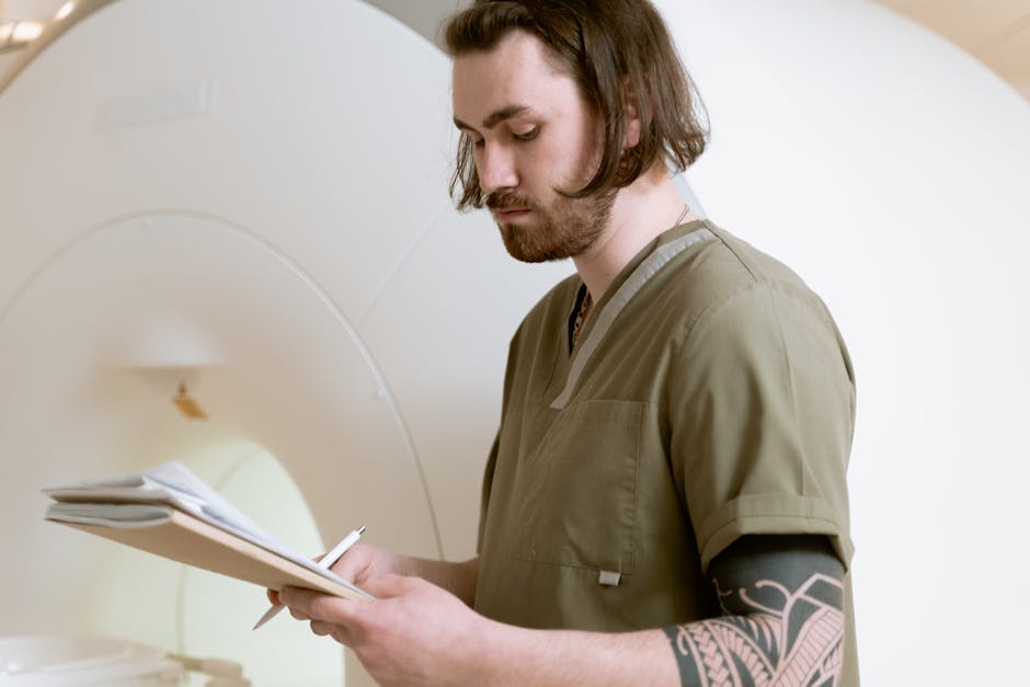 doctor looking thoughtfully at an MRI scan - delayed diagnosis claims doctor looking thoughtfully at an MRI scan - delayed diagnosis claims