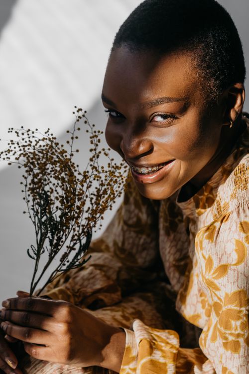 Close-Up Shot of a Pretty Woman in Gold Floral Top Smiling · Free Stock ...