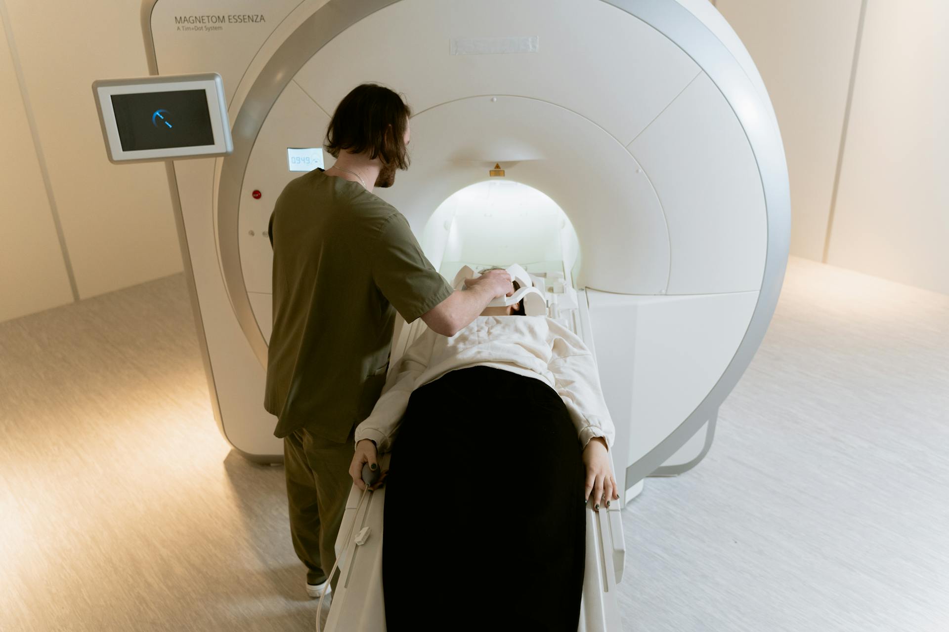 Photo Of Radiologist Operating The CT Scanner