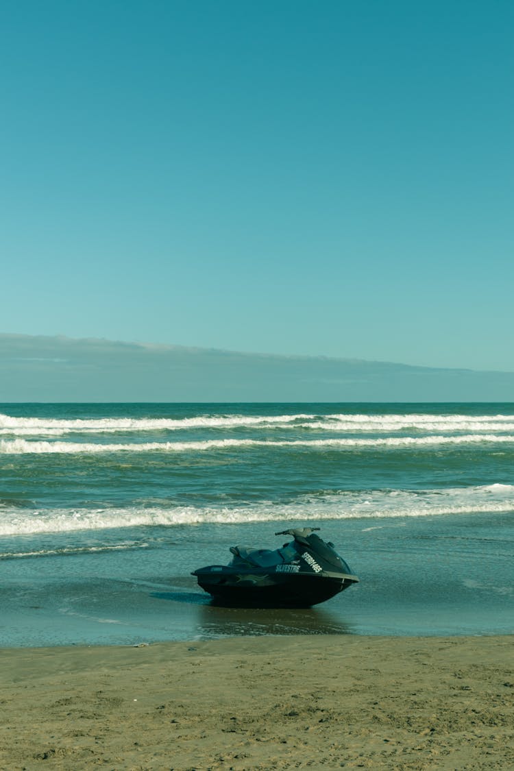 A Black Jetski On The Beach