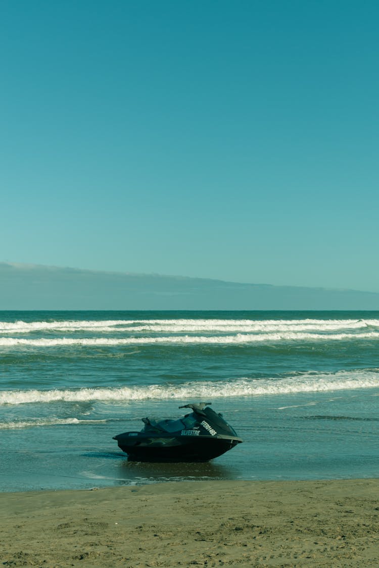 A Black Jetski On The Beach