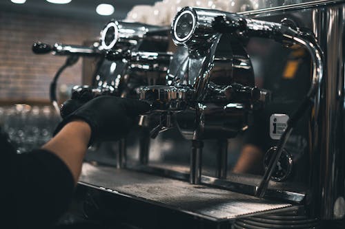 Close-Up Shot of a Person Making Coffee