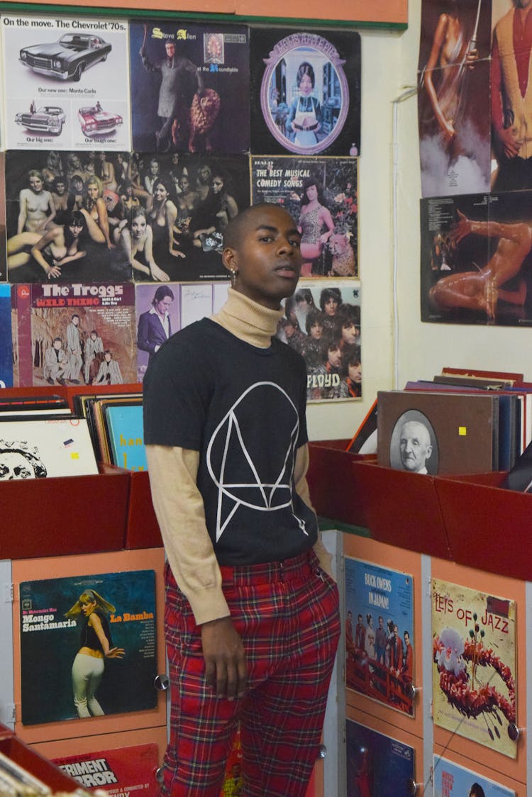 Stylish Black Man Against Retro Vinyl Records In Shop