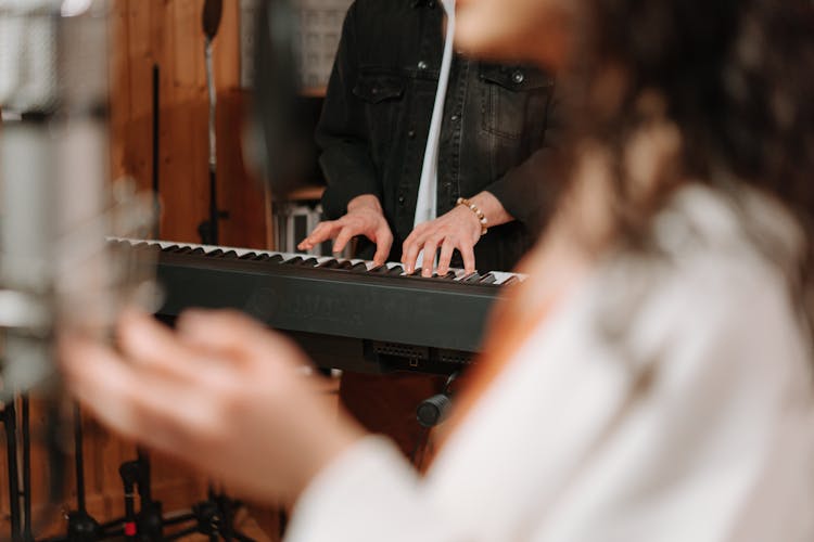 Person Playing Keyboard