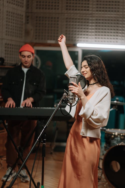 Woman Singing in a Recording Studio