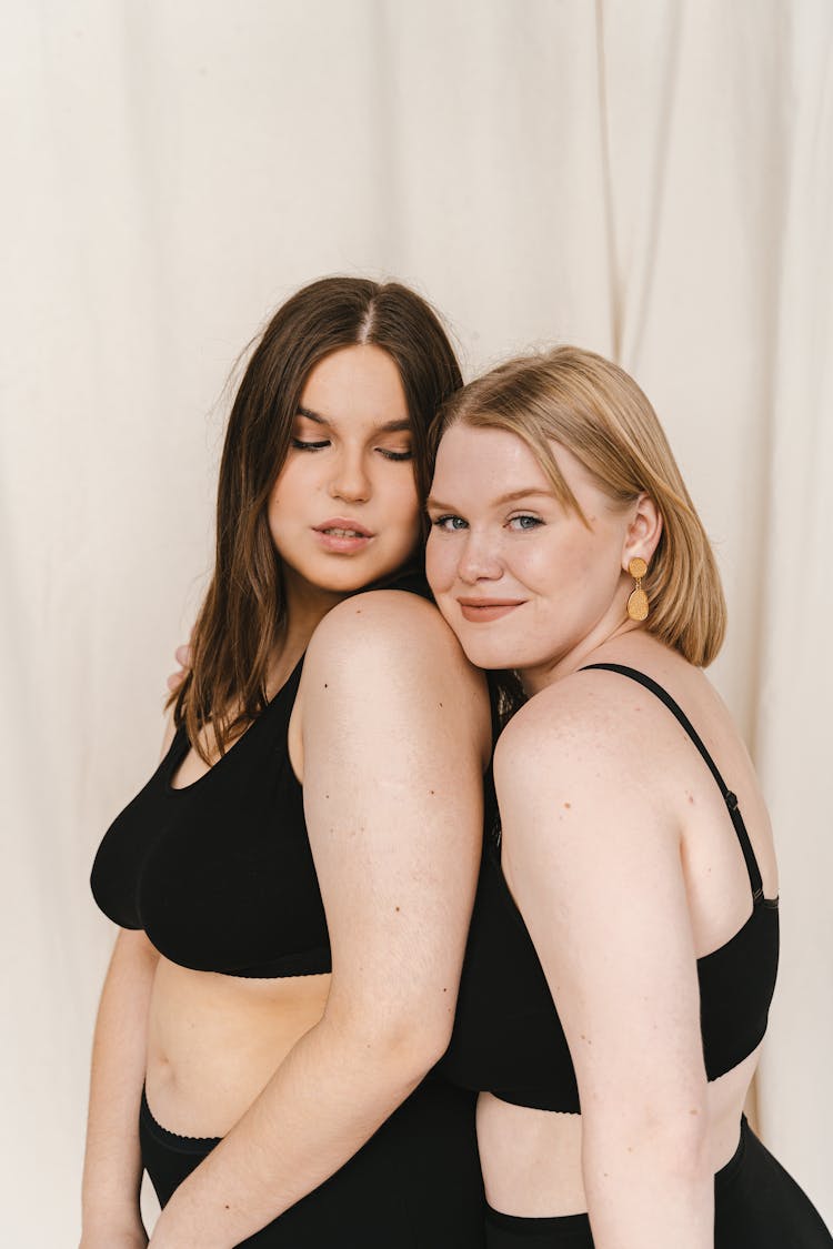 Two Women In Black Swimsuit Standing