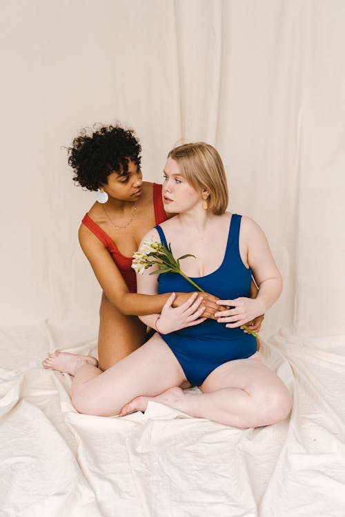 Free Women Embracing while Looking at Each Other Stock Photo