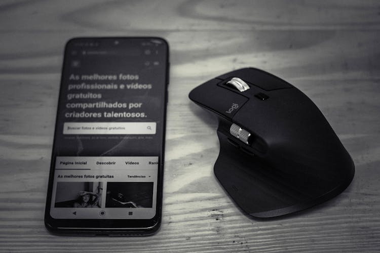 Smartphone With Site Near Game Computer Mouse