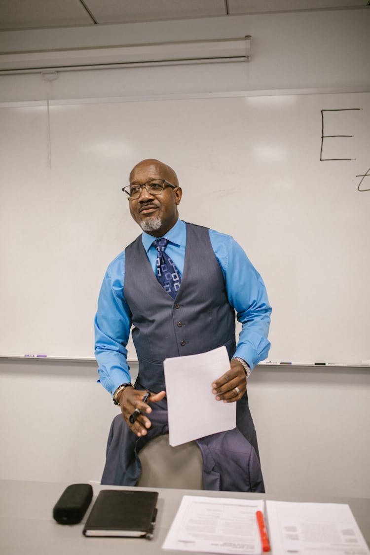 Teacher Holding A Paper