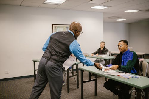 Teacher Giving the Test Result to His Student