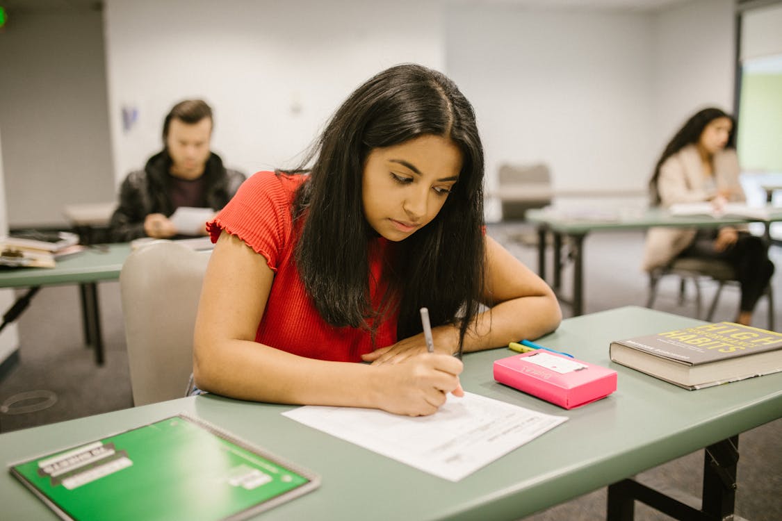 Free Student Cheating During an Exam Stock Photo