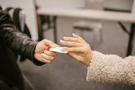 Shallow Focus Photo of Students Cheating During an Exam
