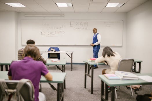 A college educator proctoring an exam, enforcing no cheating rules.