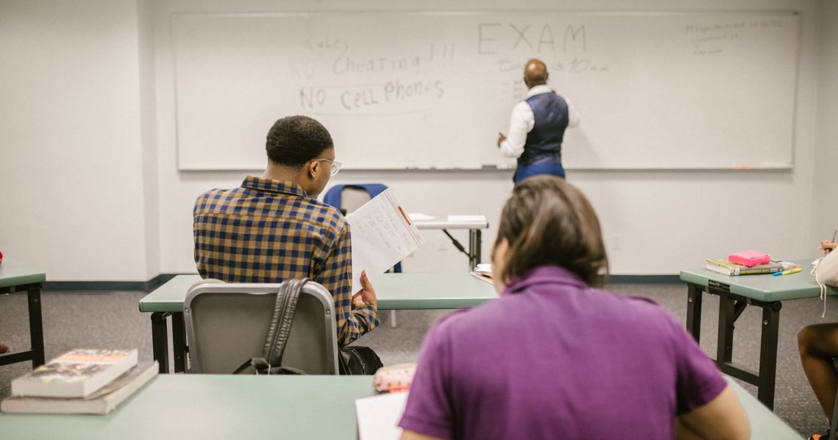 An instructor leading a coding bootcamp session with focused students.