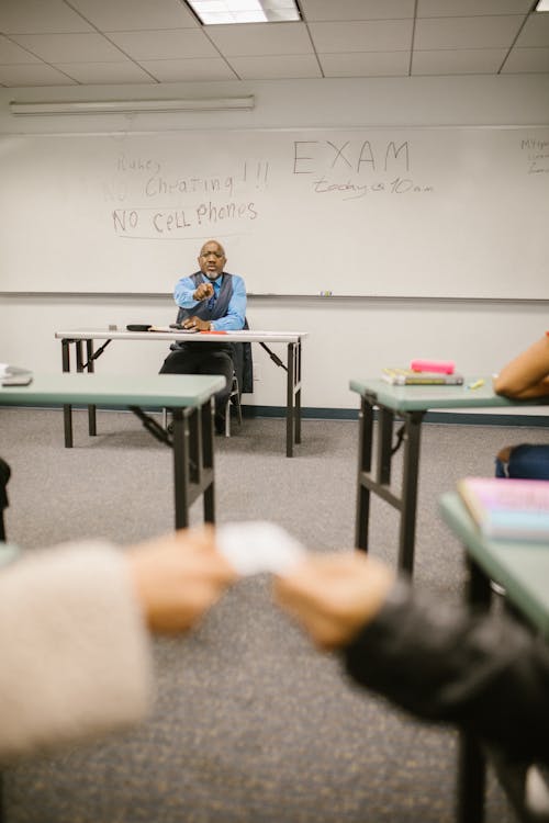 Free Teacher Caught His Students Cheating During an Exam Stock Photo