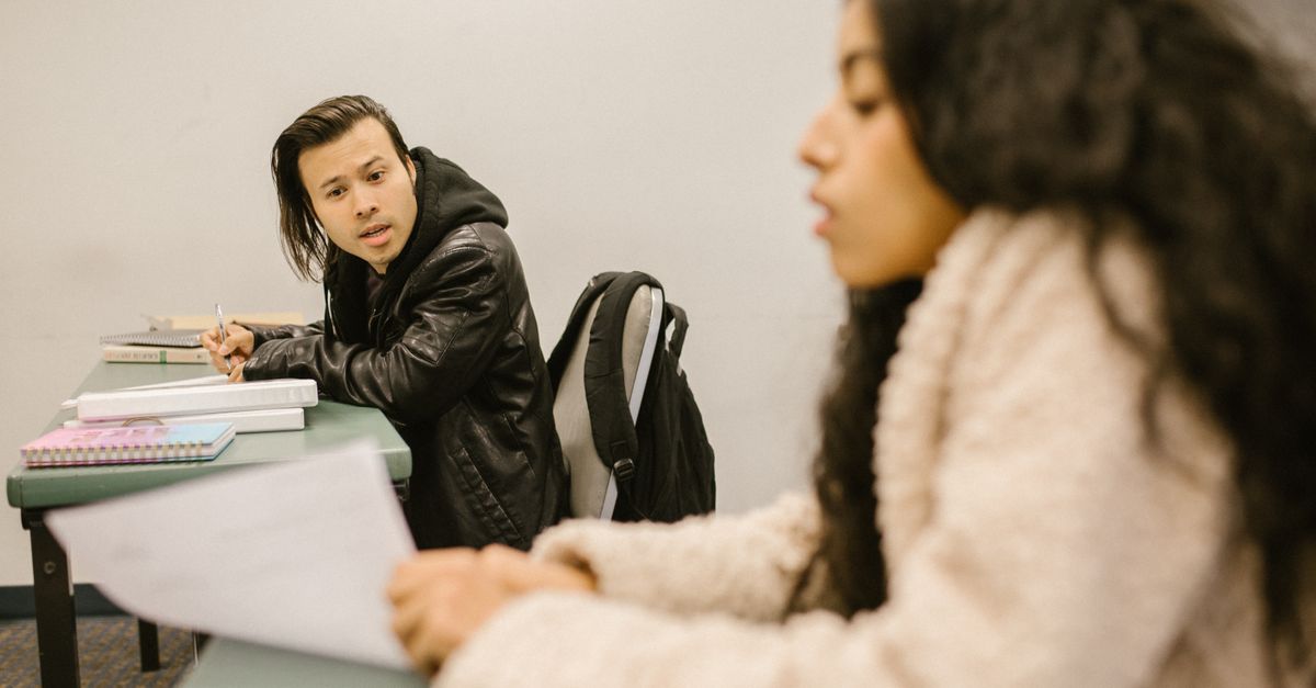 A Cheat Students Cheating During an Exam · Free Stock Photo