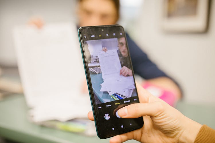 Student Taking Photo Of The Test Paper