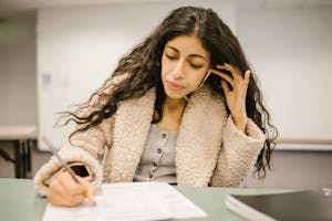 Student Cheating During an Exam by Using an Earphone