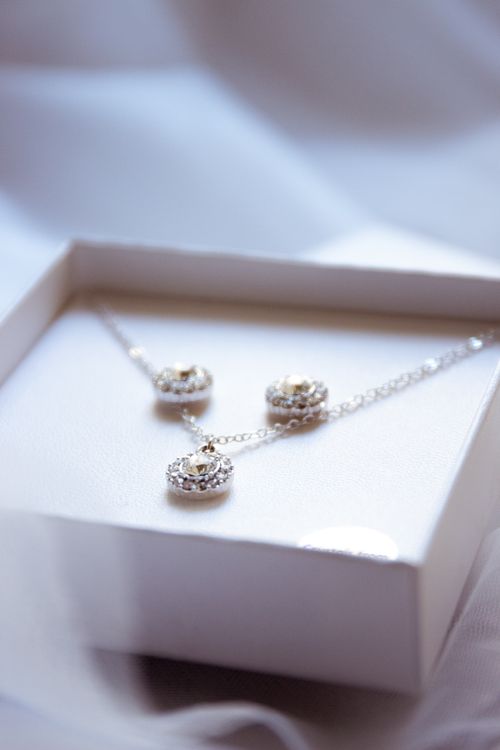 Free Luxurious diamond necklace and earrings set in an elegant box, perfect for gifting. Stock Photo