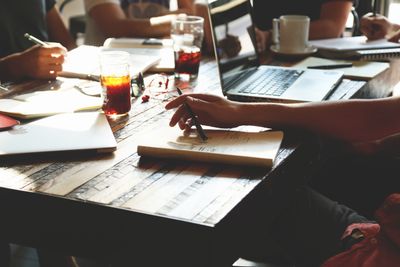 Team reviewing notes around a table — photo by Startup Stock Photos on Pexels