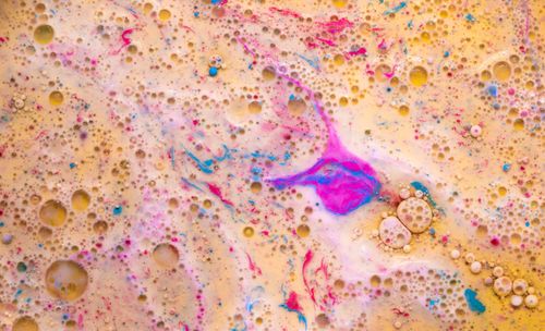 Free Colorful abstract art with bubbles created by mixing oil and water with pigments. Stock Photo