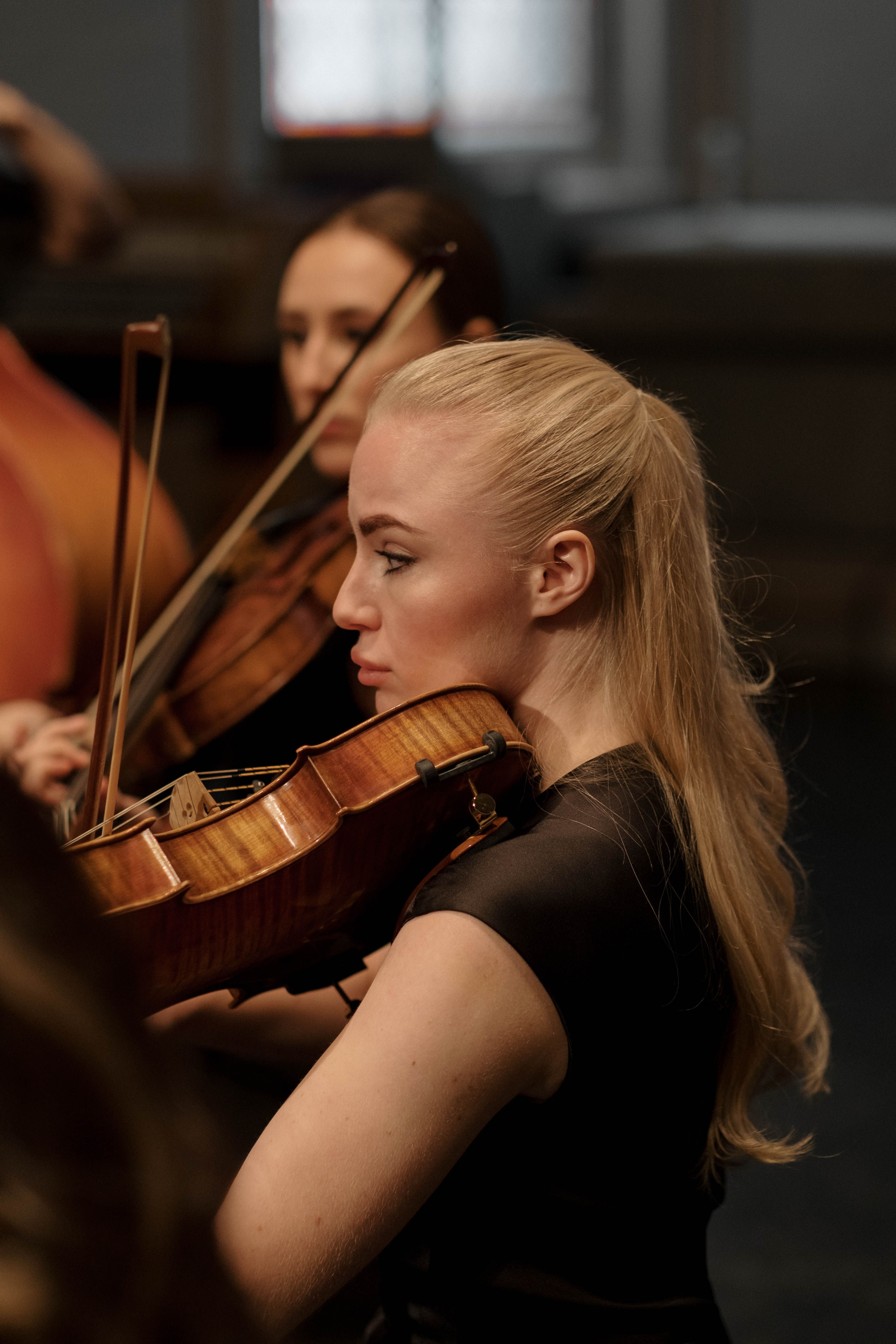 A violinist mid-phrase