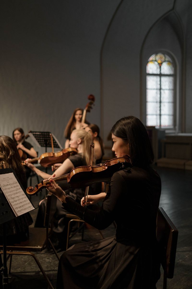 String ensemble performing in a dark church