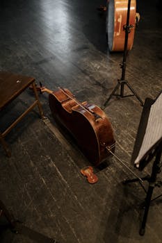 A cello resting on stage, capturing the essence of classical music performance.