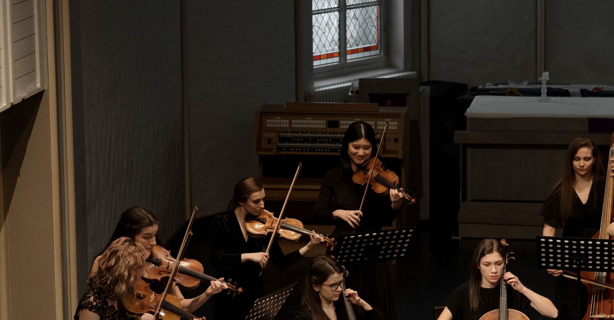 Playing Music Instrument A Group of People Playing Musical Instruments on the Stage · Free Stock ...