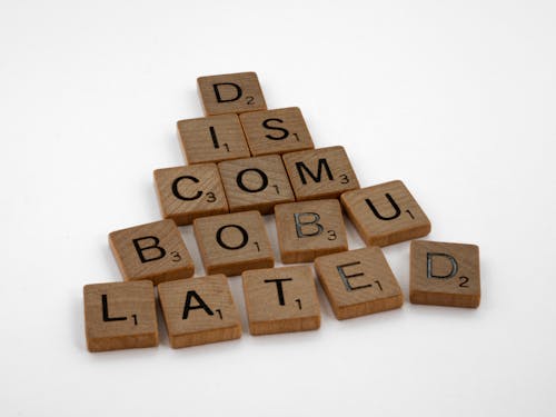 Brown Wooden Scrabble Tile on White Background