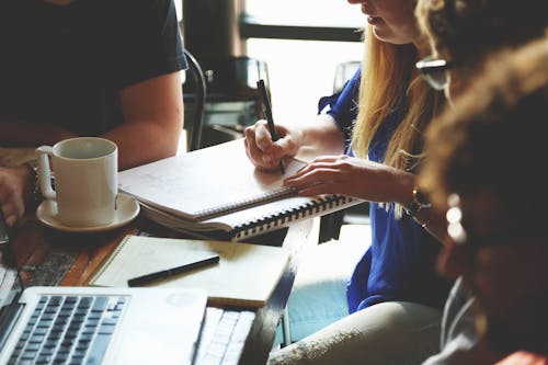 Free Person Writing on the Notebook Stock Photo