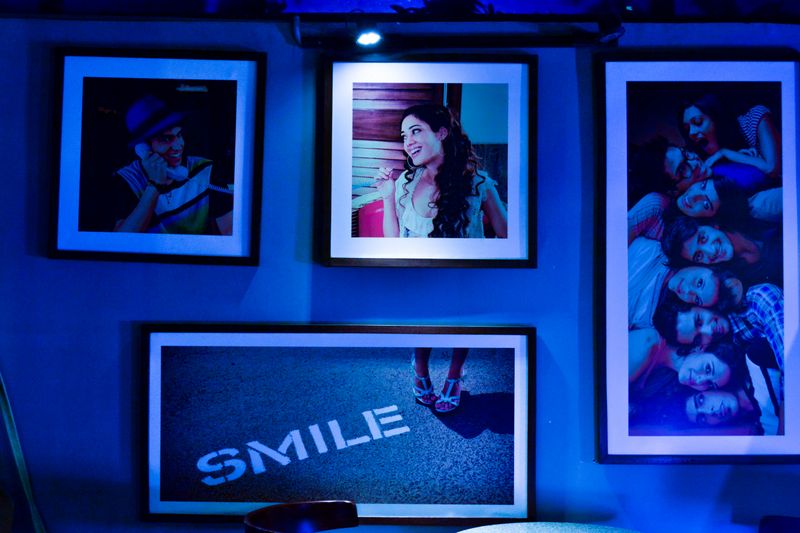 Assorted personalised photo frames on a wall