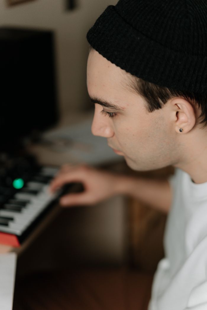 A young musician playing an electric keyboard — photo by cottonbro studio on Pexels