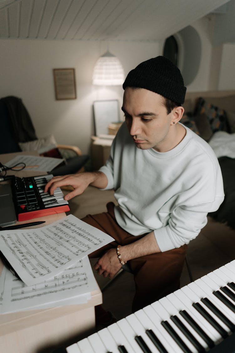 A Man Reading Musical Notes