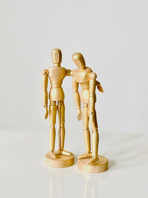 Free Close-Up Shot of Wooden Human Models Stock Photo