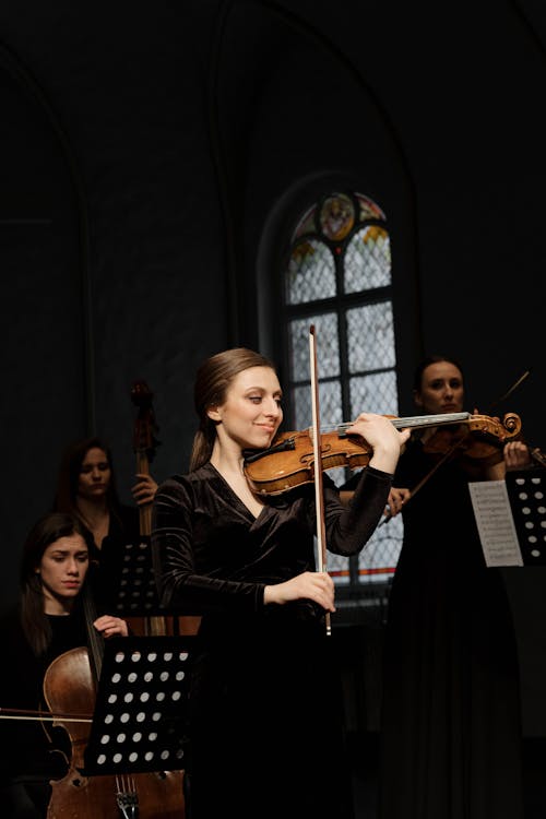 Women Playing Musical Instruments in an Orchestra