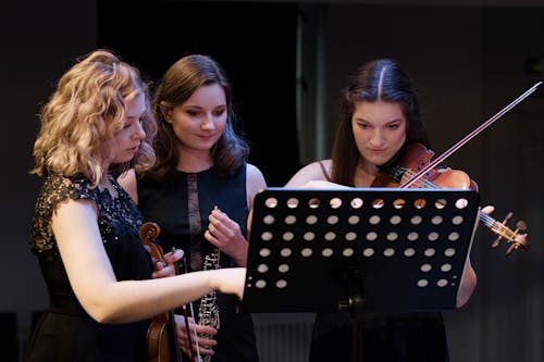 A Women Looking the Musical Notes