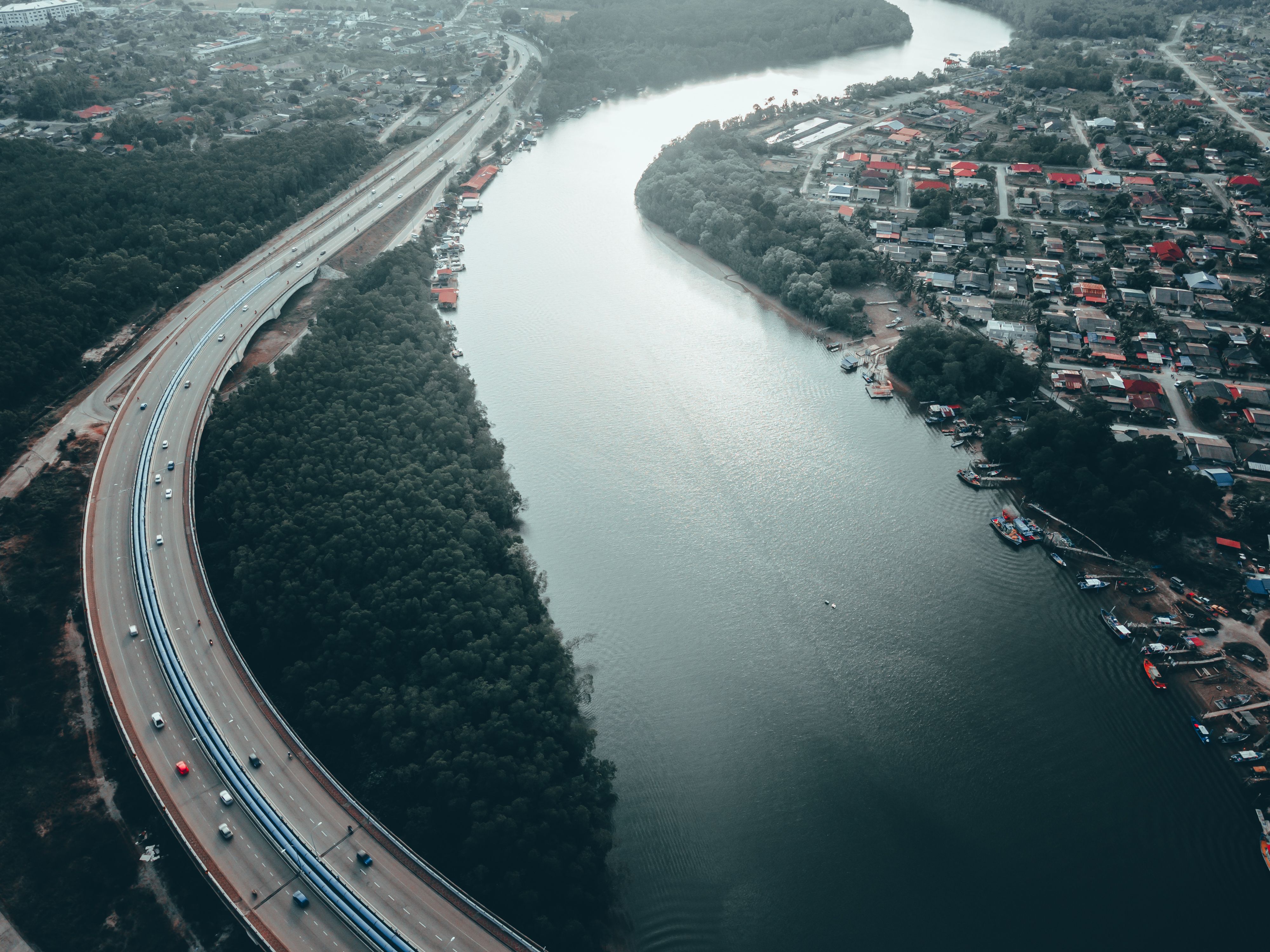 City with buildings and roads near river · Free Stock Photo
