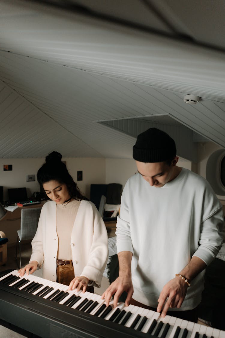 Man And Woman Playing Piano