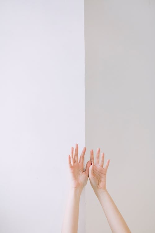 Free Person Two Hand Leaning on Wall Stock Photo
