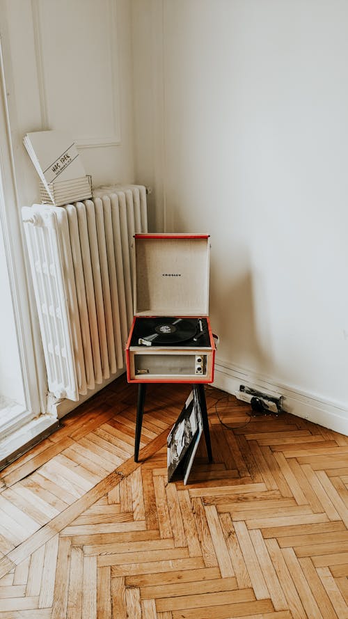 Room interior with vintage vinyl player on stool