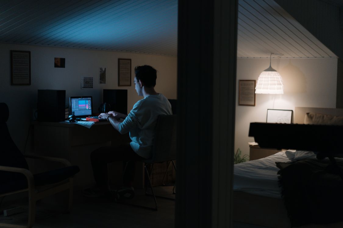 Man in White LongSleeve Shirt Sitting on Chair in Front of Computer ...