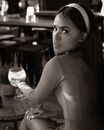 Woman in White Tank Top Holding Clear Glass Cup