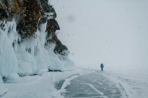 Winter Landscape with a Person Walking in the Snow